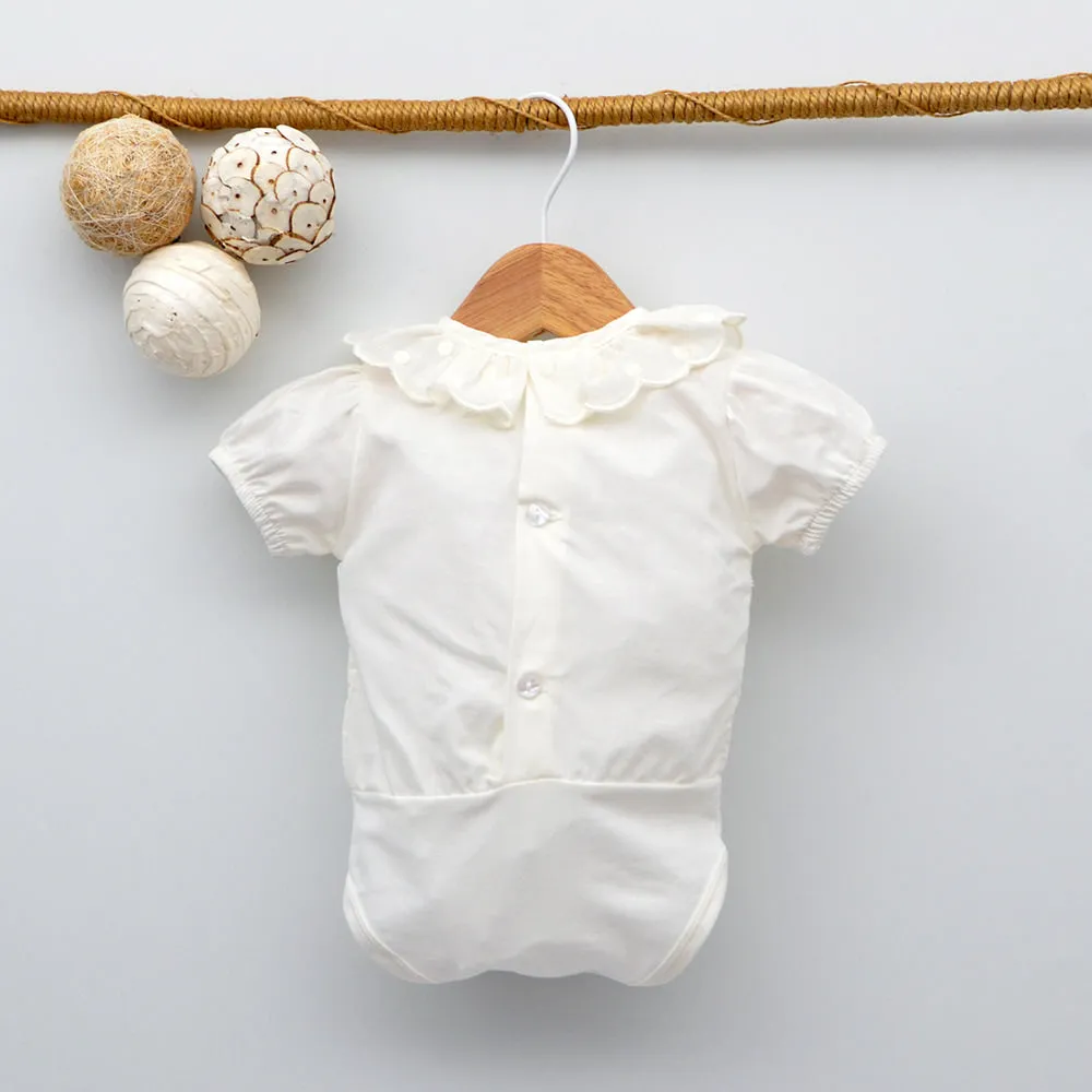 Body bebé Abril camisa con bodoques manga corta
